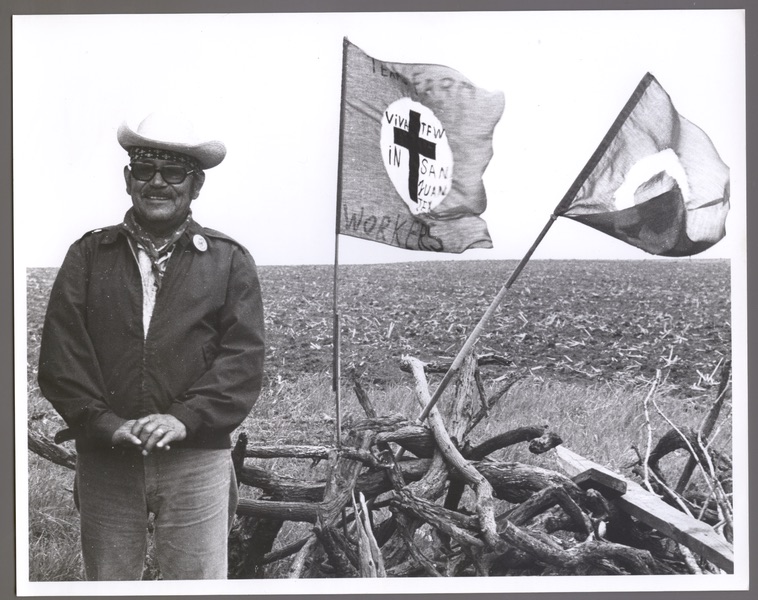 Man standing in front of TFWU Banner - Peregrinacion from San Juan to Austin