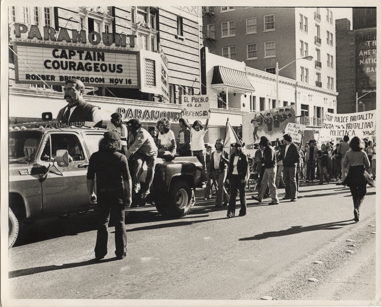 black and white photo of Brown Berets at police brutality protest