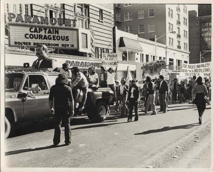 Brown Berets in truck in front of Paramount Theater, Austin, Texas black and white photo of Brown Berets at police brutality protest