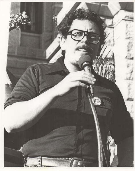 José Angel Gutiérrez, speaking at protest at State Capital, Austin black and white photo of José Angel Gutiérrez speaking at a police brutality protest