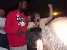 Maria Jimenez speaks to 4000 persons at post-Immigrant Workers Freedom Ride rally, September 2003.